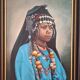 Portrait of a young Moroccan woman in traditional attire and adornments.