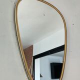 Free-form asymmetrical mirror from the 60s and 70s