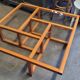 Modernist vintage square coffee table, in wood and old glass