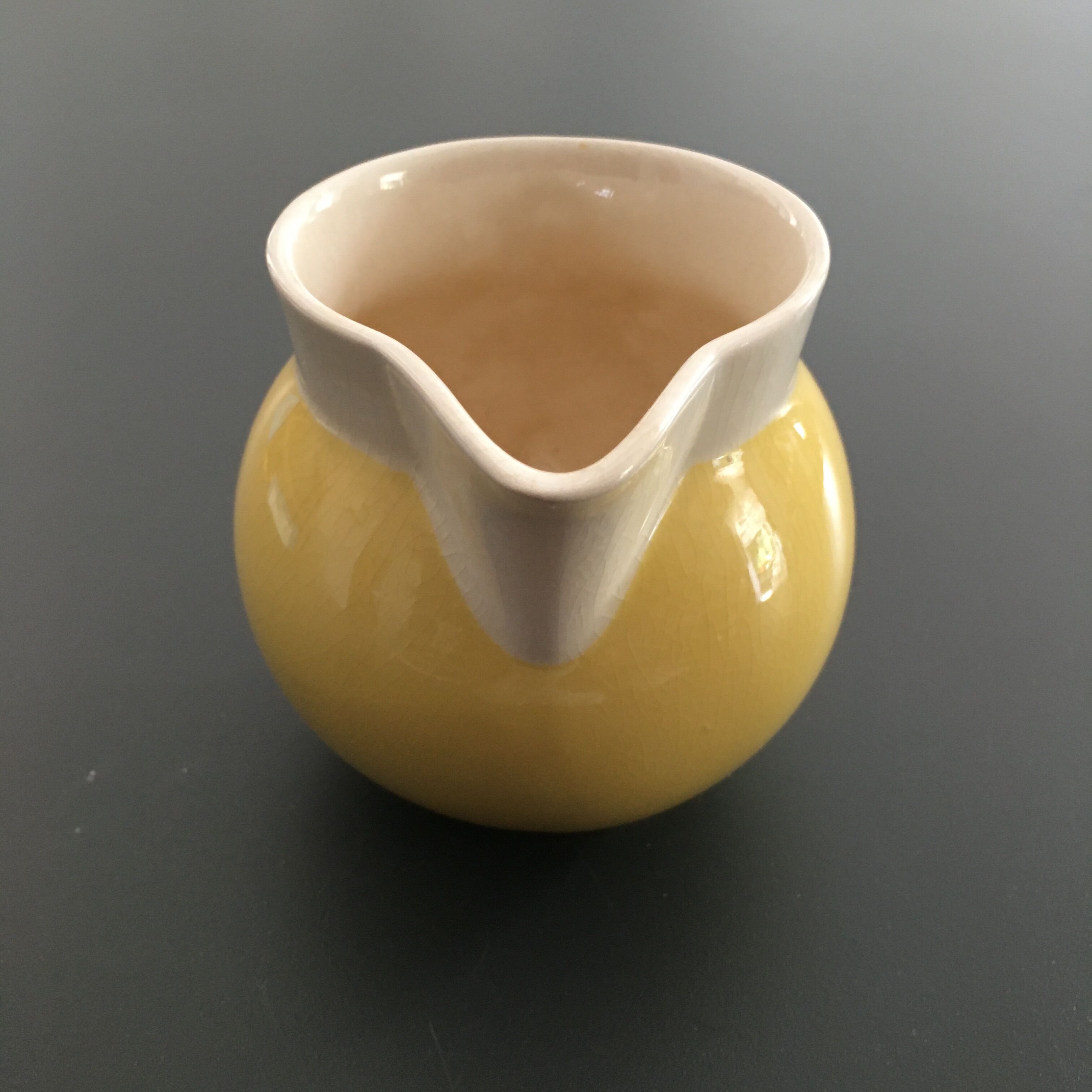 Yellow straw and ivory pitcher