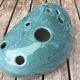 Roller spike flowers, blue-green ceramics
