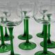 Set of 8 green stemmed wine glasses made in France.