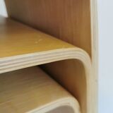 Design stool/side table made of curved plywood.