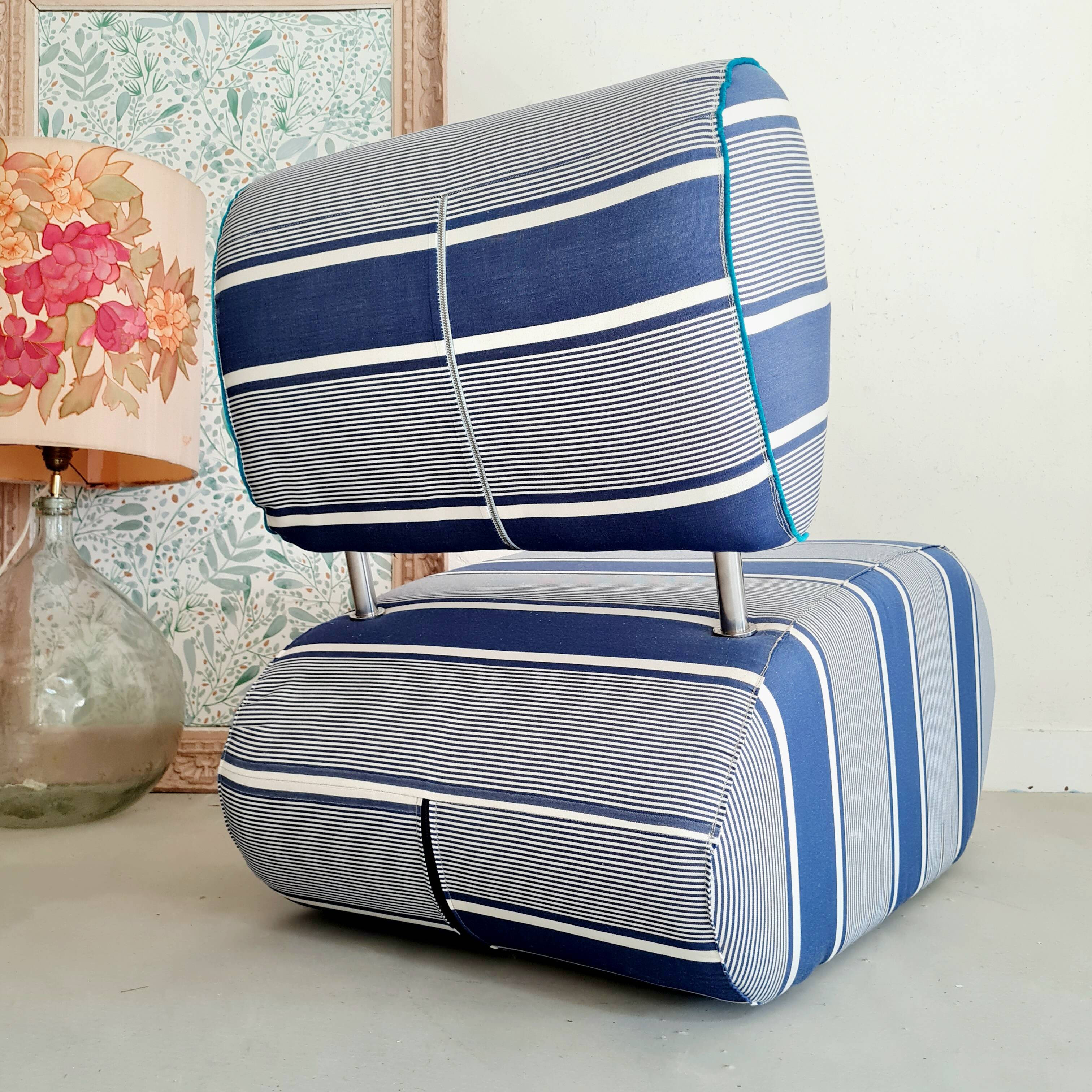Curved armchair with blue and white stripes
