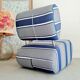 Curved armchair with blue and white stripes