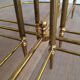 Round brass coffee table in neoclassical style