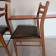 5 Scandinavian style chairs, wood and black faux leather.