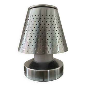 Designer lamp in perforated stainless steel