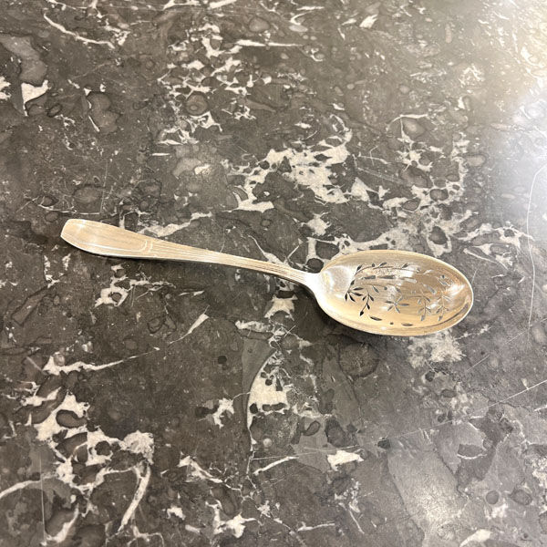 Openwork serving spoon, silver metal