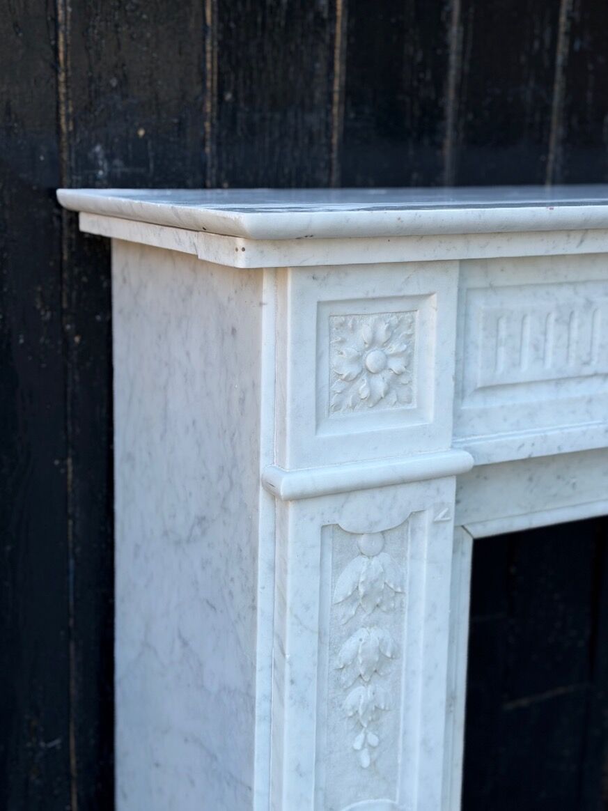 Louis XVI style fireplace in white Carrara marble, circa 1880.