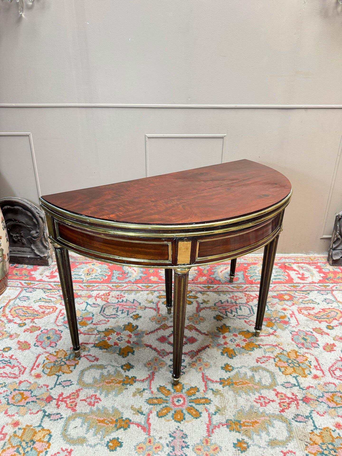 Half-moon table in mahogany from the Louis XVI period, 18th century.