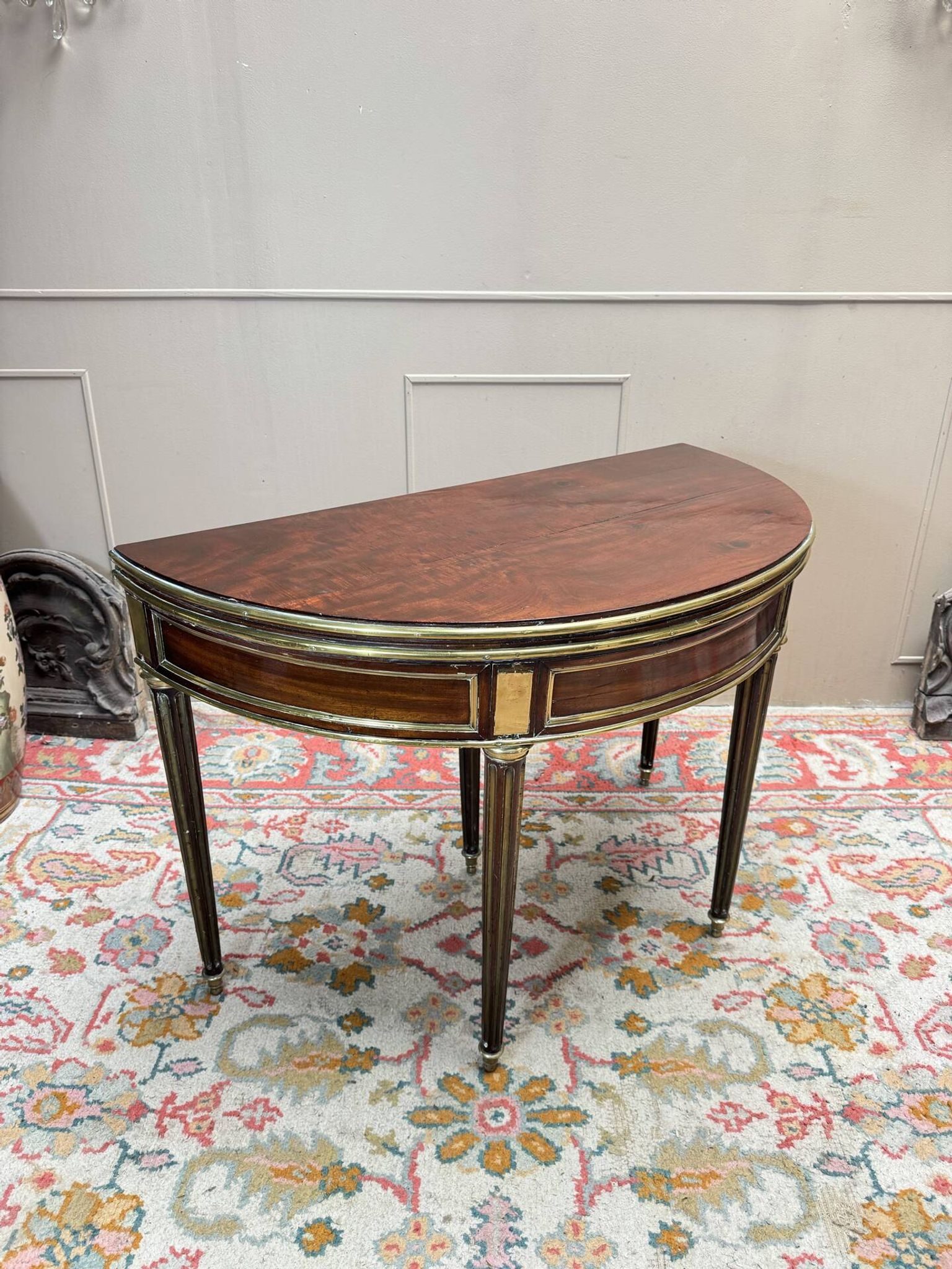 Half-moon table in mahogany from the Louis XVI period, 18th century.