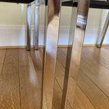 Pair of brown low chairs with chrome base