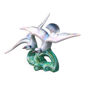 Old barbotine statue seagulls on the wave