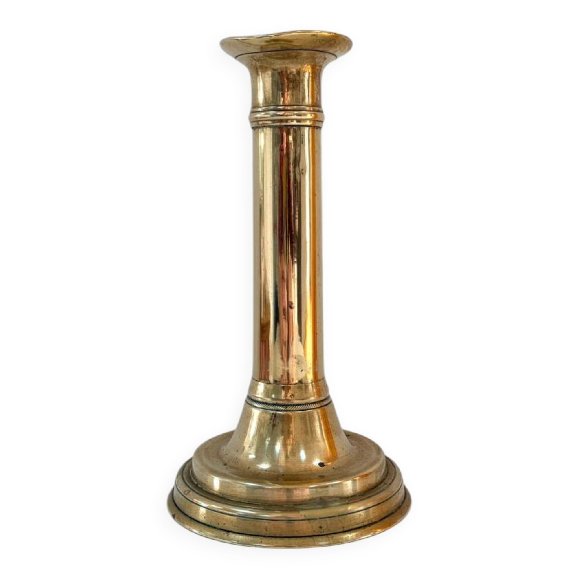Old brass candlestick with push button.