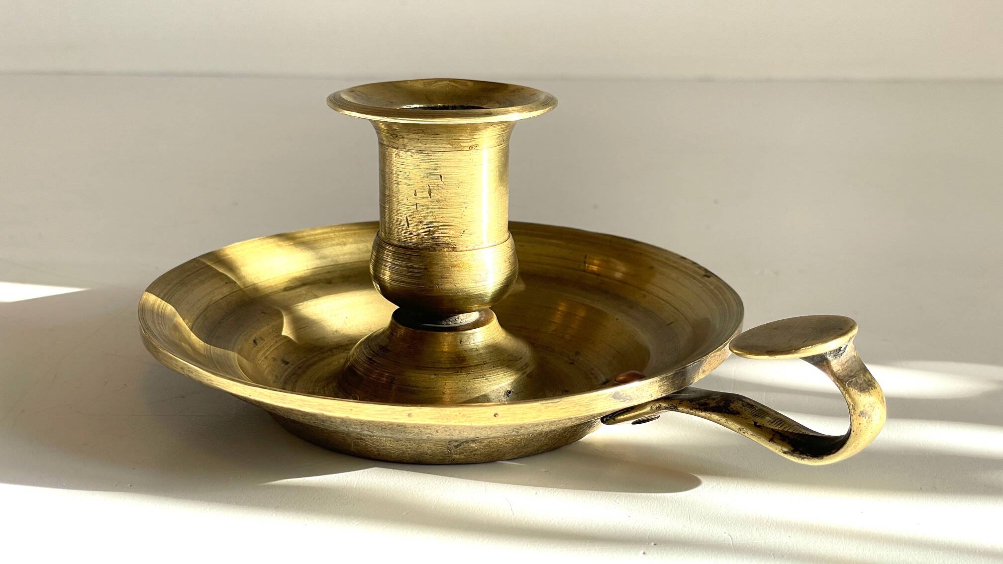 Antique solid bronze hand candlestick