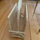 Vintage magazine rack in woven rattan and bamboo.