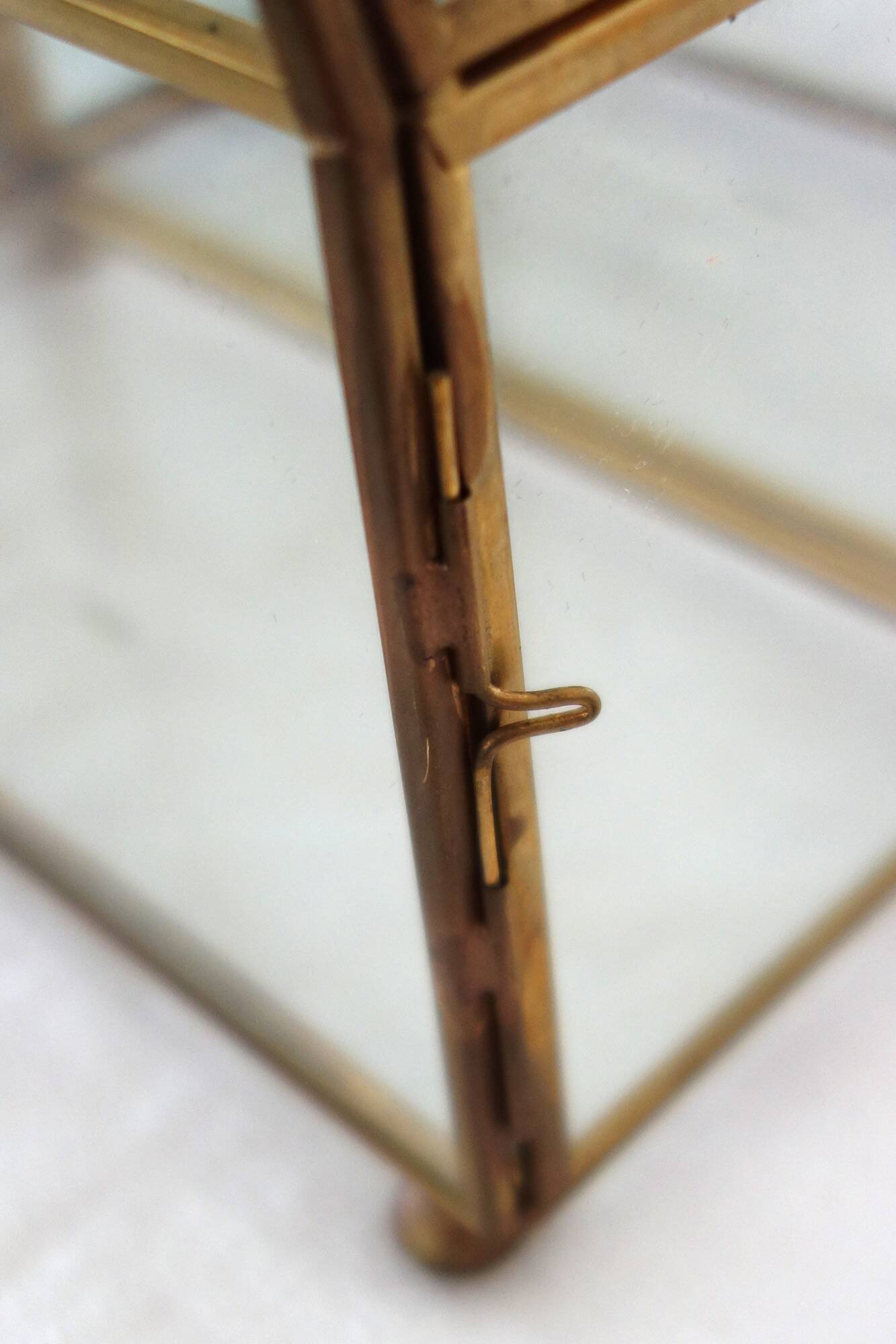 Pair of gilded brass, glass, mirror display cases from the 60s