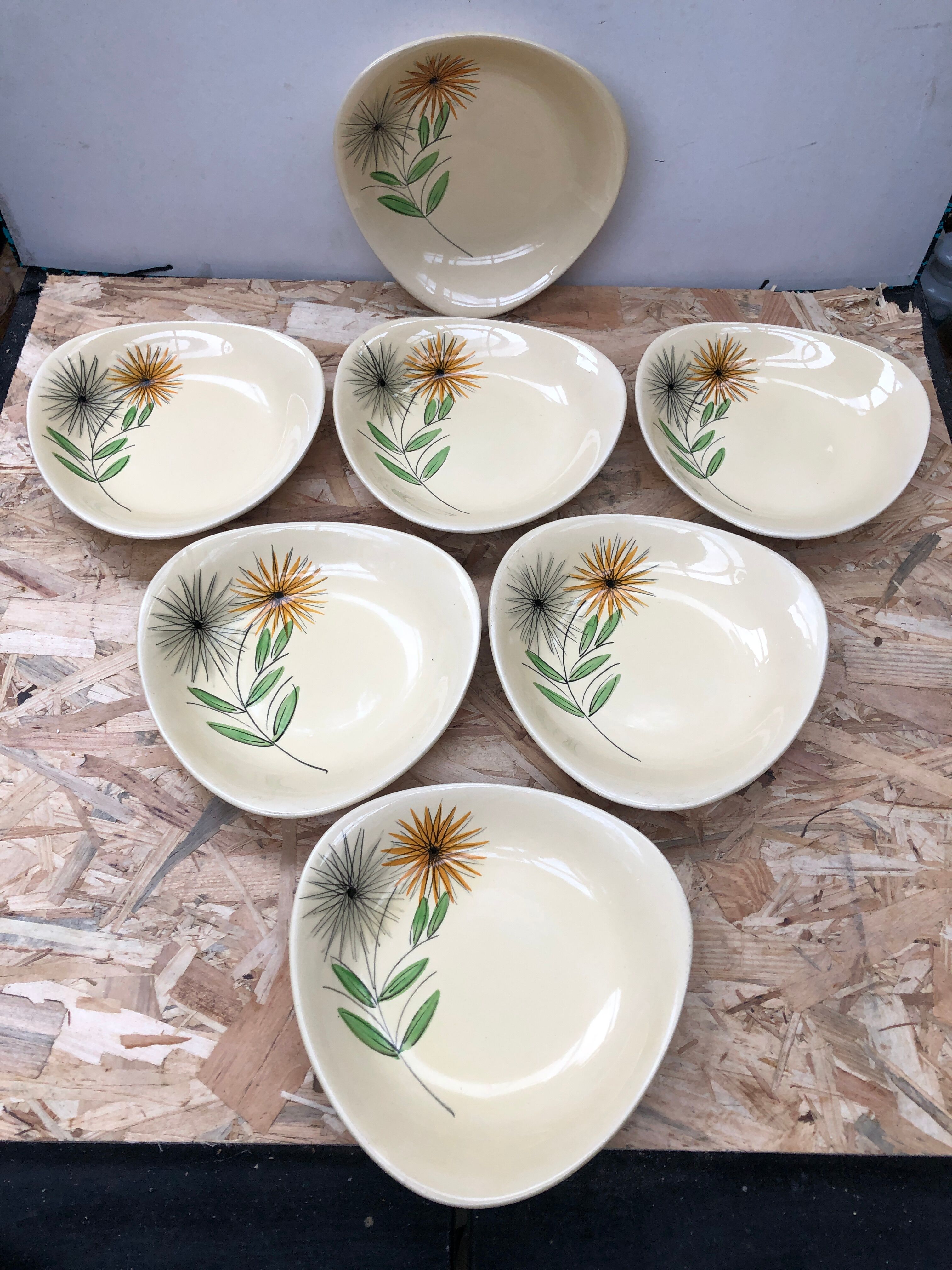 Set of 7 antique St. Clement Sirius pattern ceramic plates