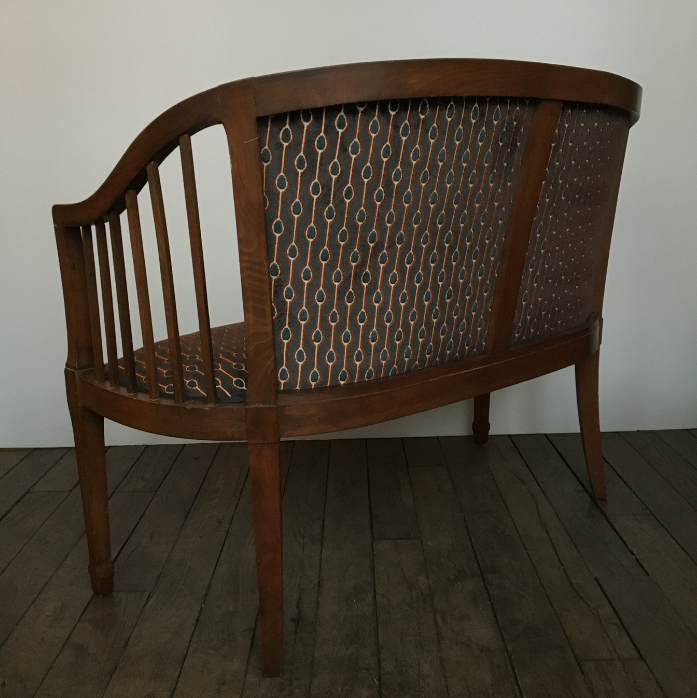 Old wooden and velvet bench