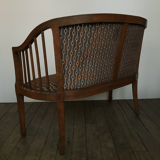 Old wooden and velvet bench