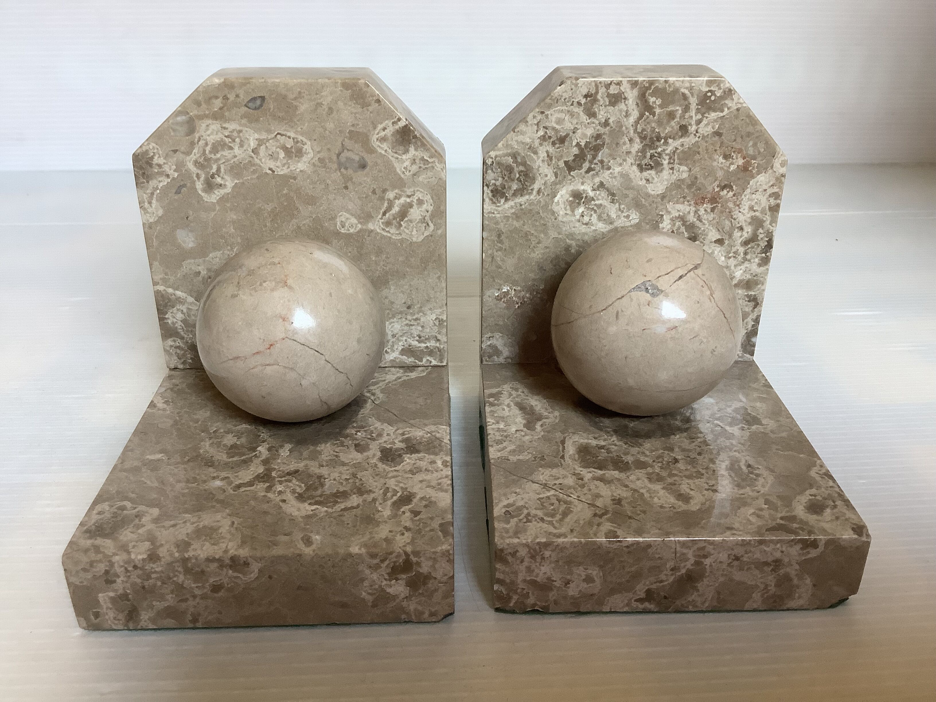 Pair of beige marble bookends.