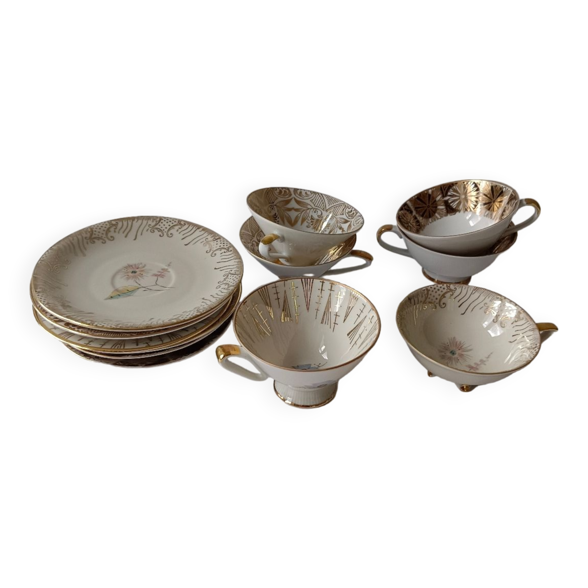 Set of mismatched fine porcelain cups signed with saucer