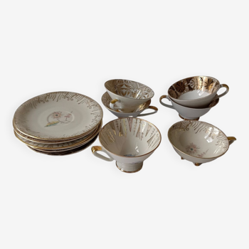 Set of mismatched fine porcelain cups signed with saucer