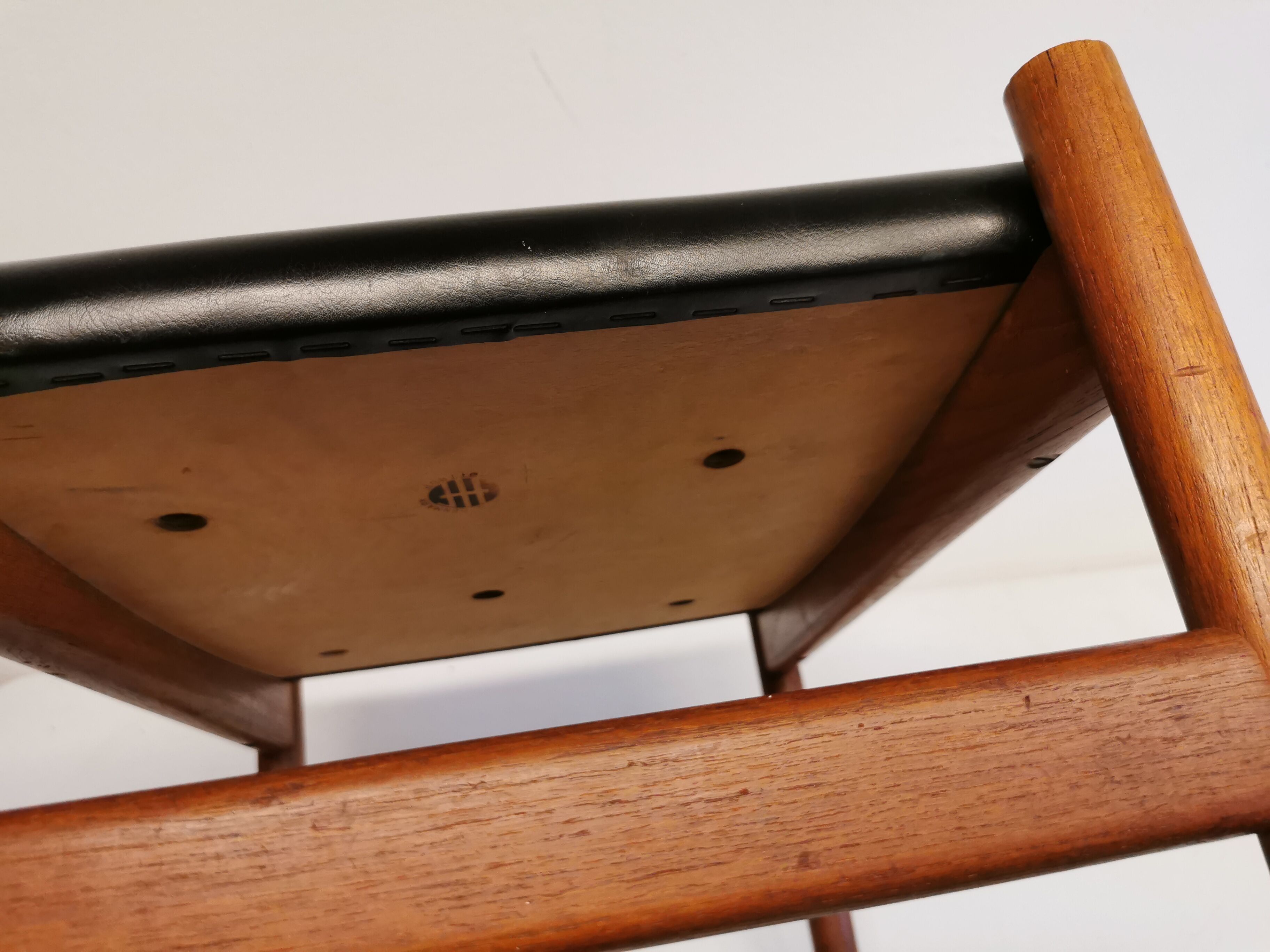 Danish designed footstool, in teak and black skai. Made at Spøttrup furniture factory in the 1960s.