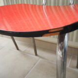 TABLE with two Italian EXTENSIONS and its 6 vintage CHAIRS of the 1970s in red color