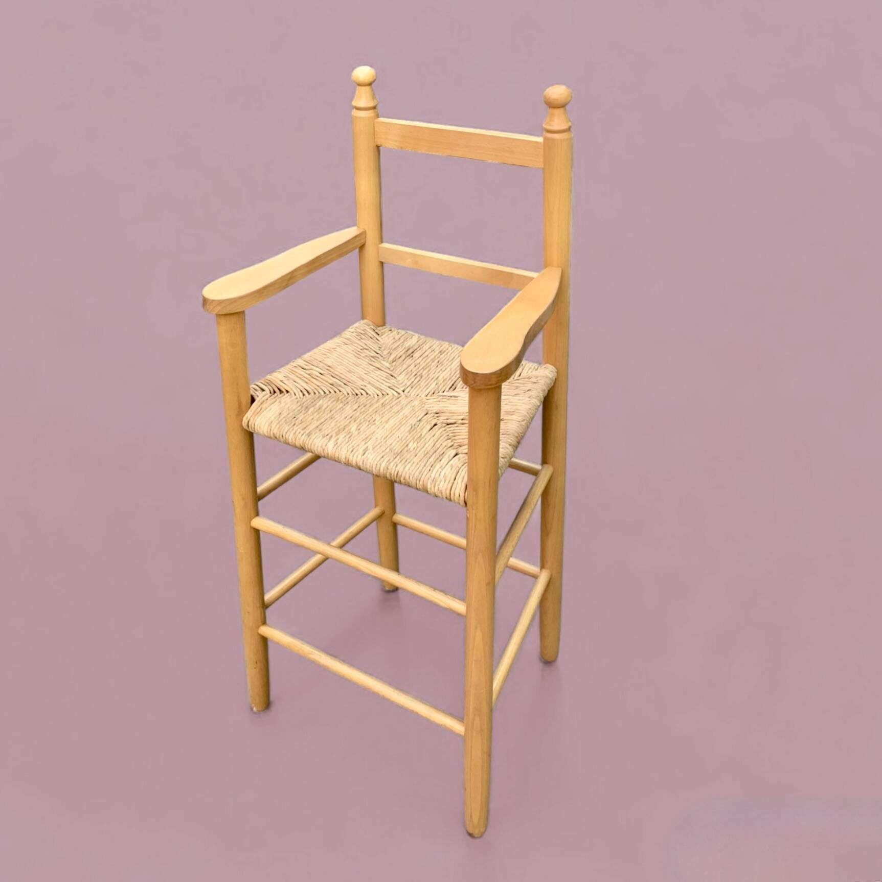 Old wooden and straw high chair for children
