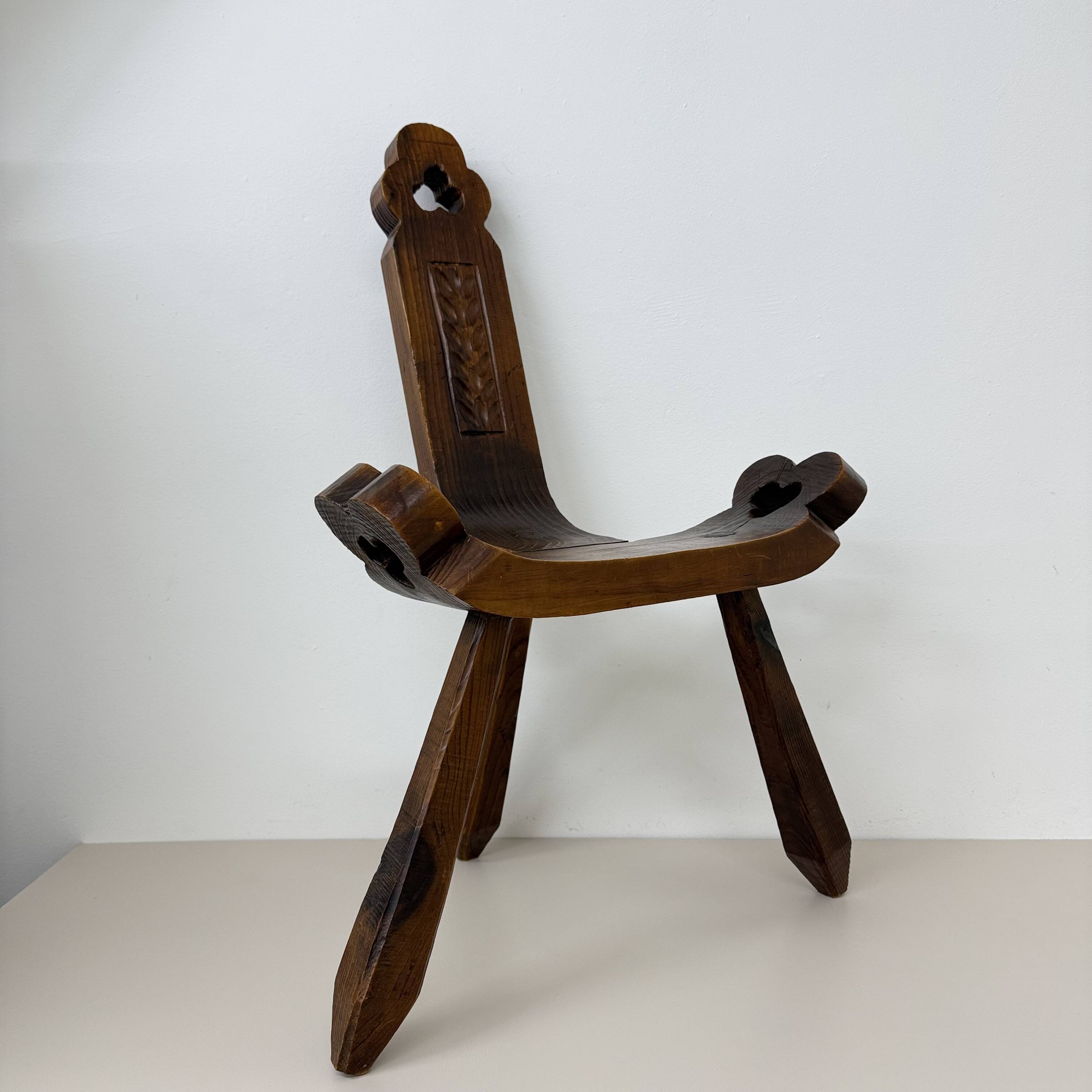 Brutalist hand carved oak Spanish tripod chair , 1970s