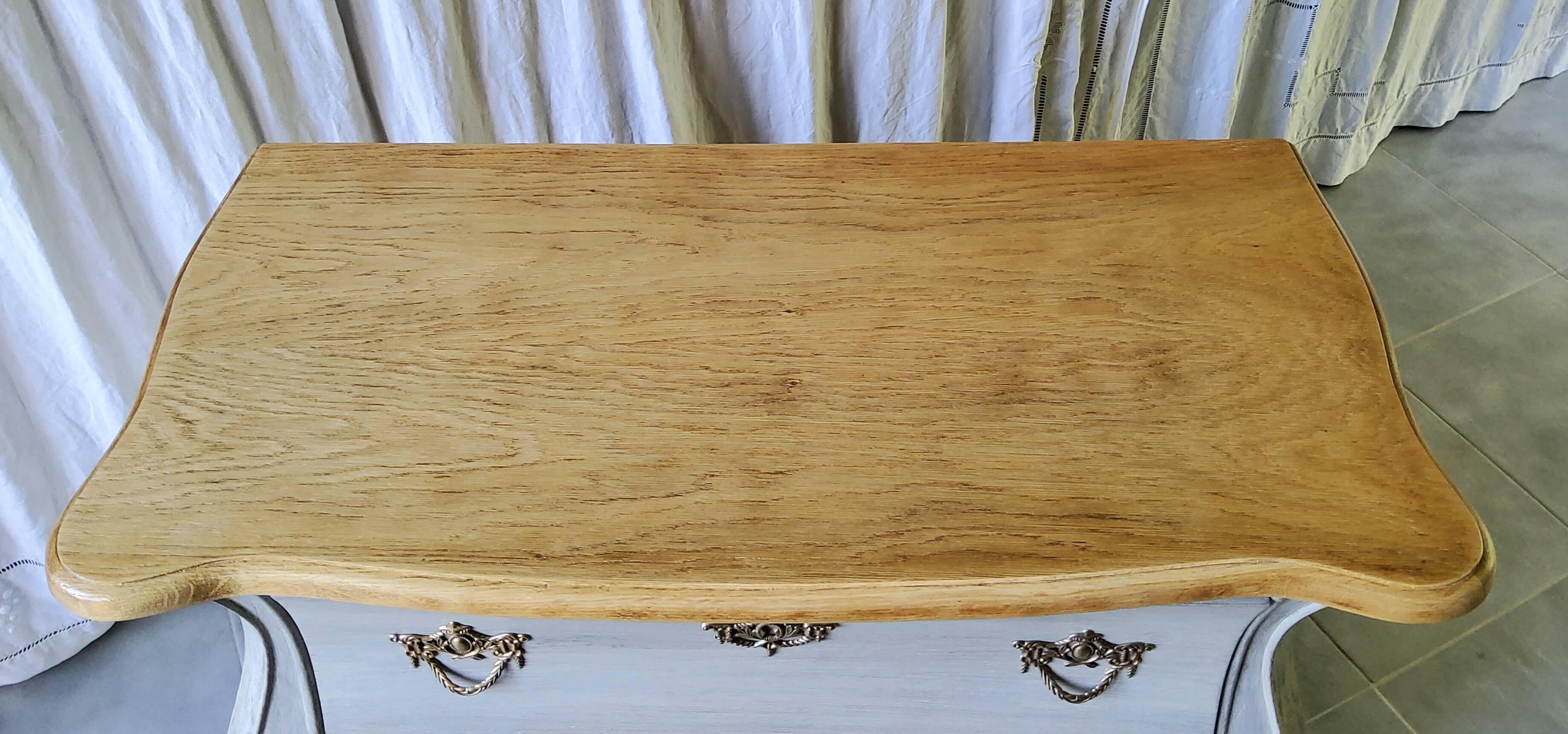 Curved patinated chest of drawers