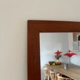 Vintage Danish teak mirror with a rounded back.