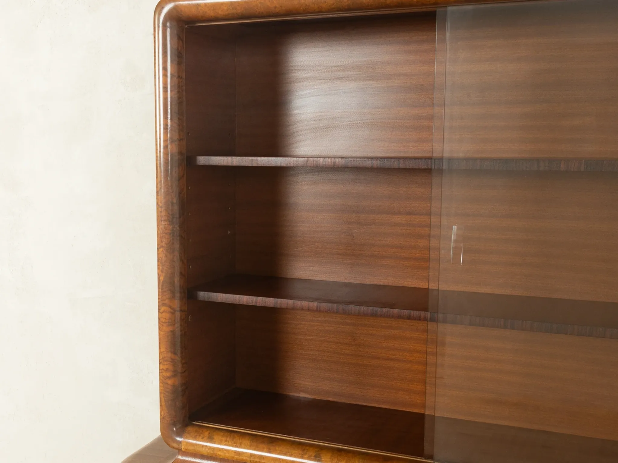 Classic two-piece Art Deco display cabinet from the 1930s with striking burl wood veneer