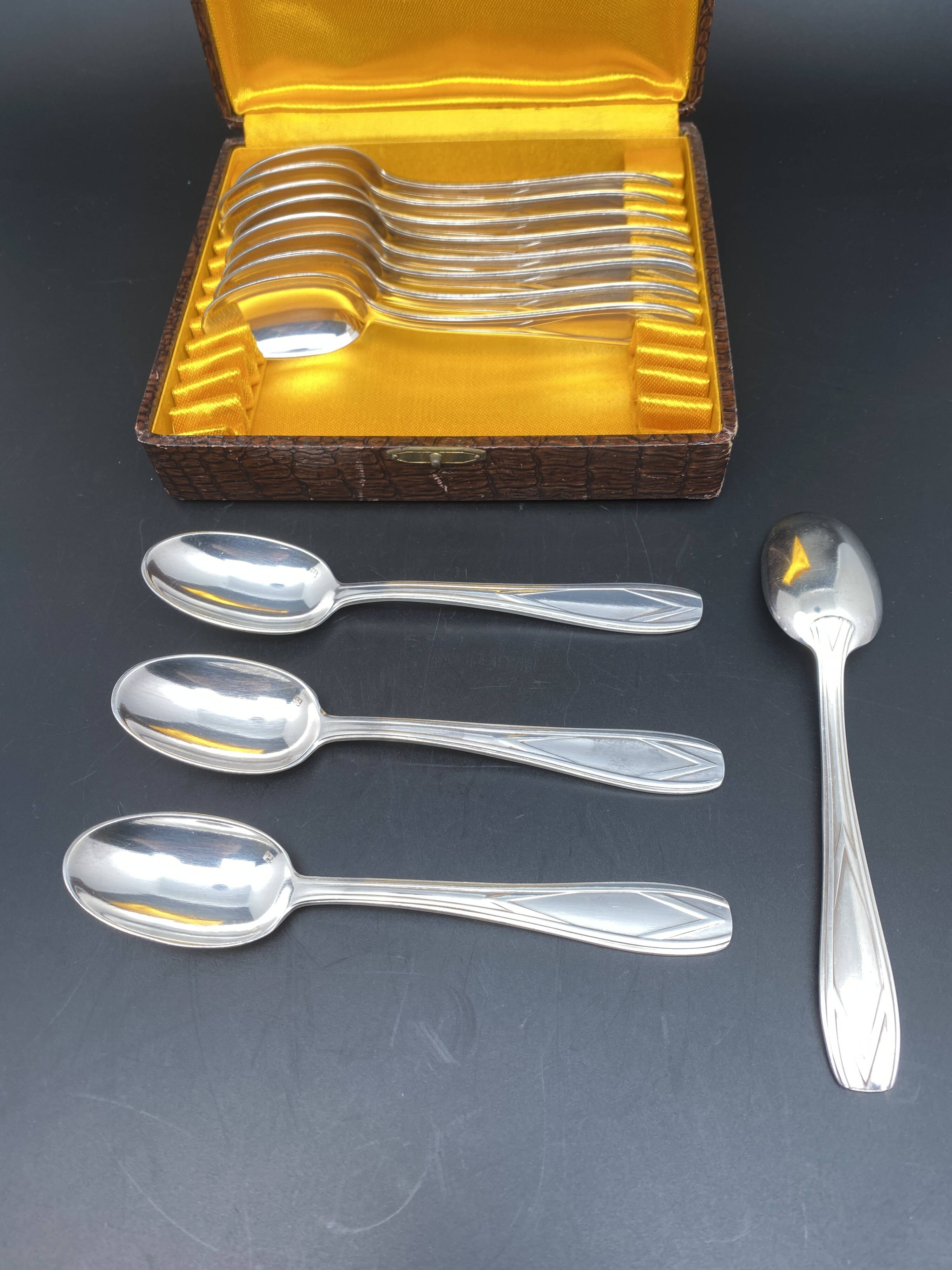 Dessert spoons in silver-white metal
