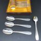Dessert spoons in silver-white metal