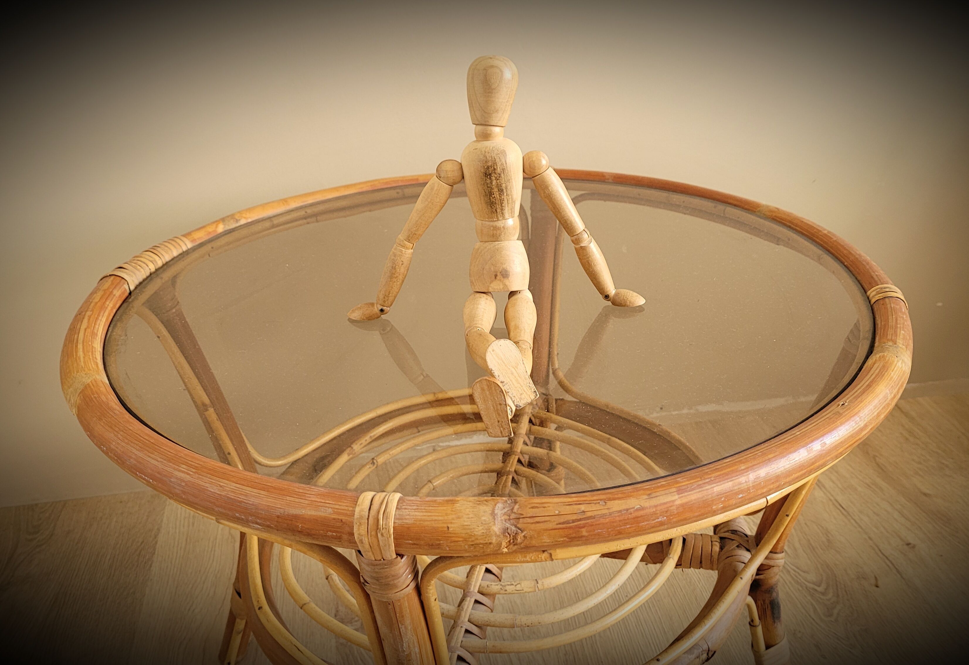 Light rattan lounge table and smoked glass