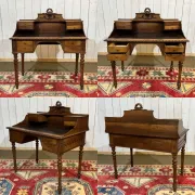 Louis XVI style desk from the late 19th century in walnut with a leather top.