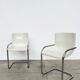 Pair of white moulded shell chairs with chrome tube — Space Age 70s