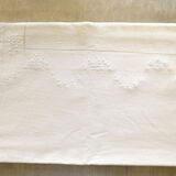 Old white tablecloth embroidered in linen