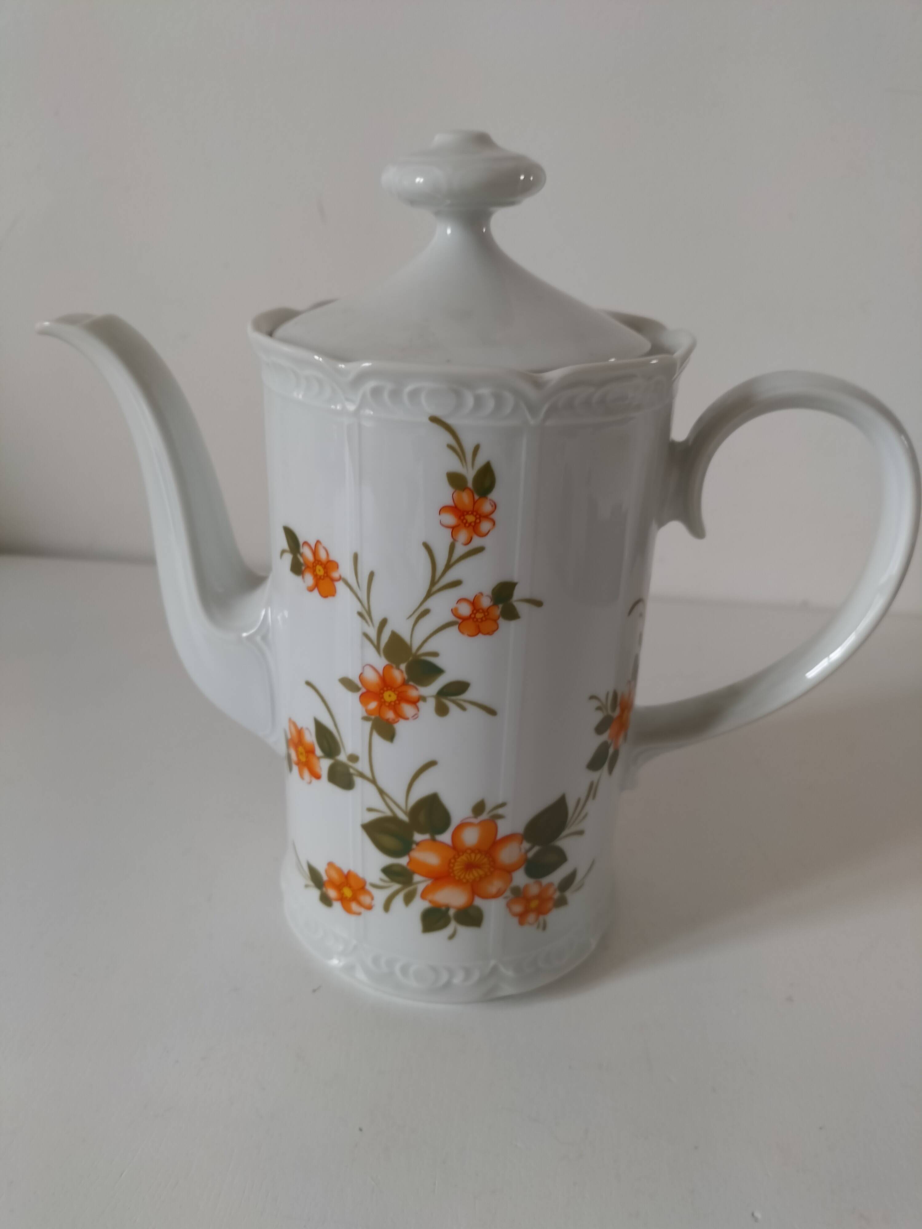 Vintage coffee pot Winterling Bavaria with orange floral decoration.