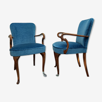 Paire de fauteuils en velours bleu