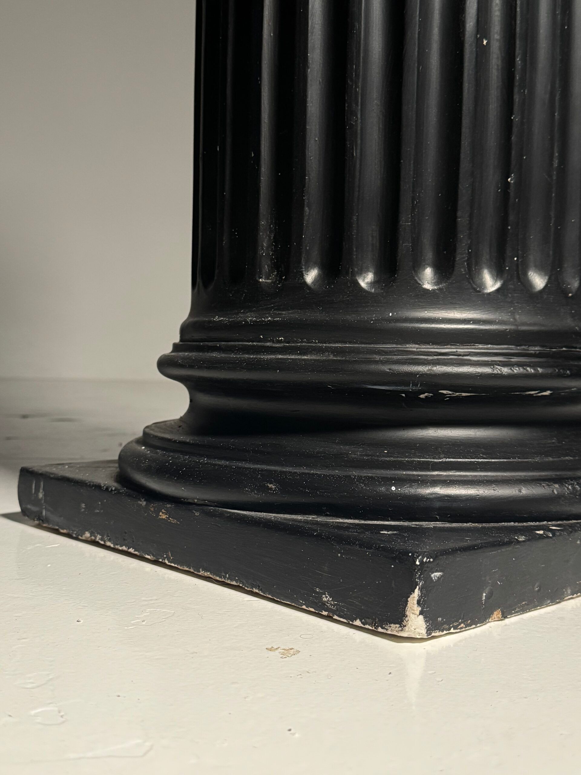 Neoclassical black plaster column