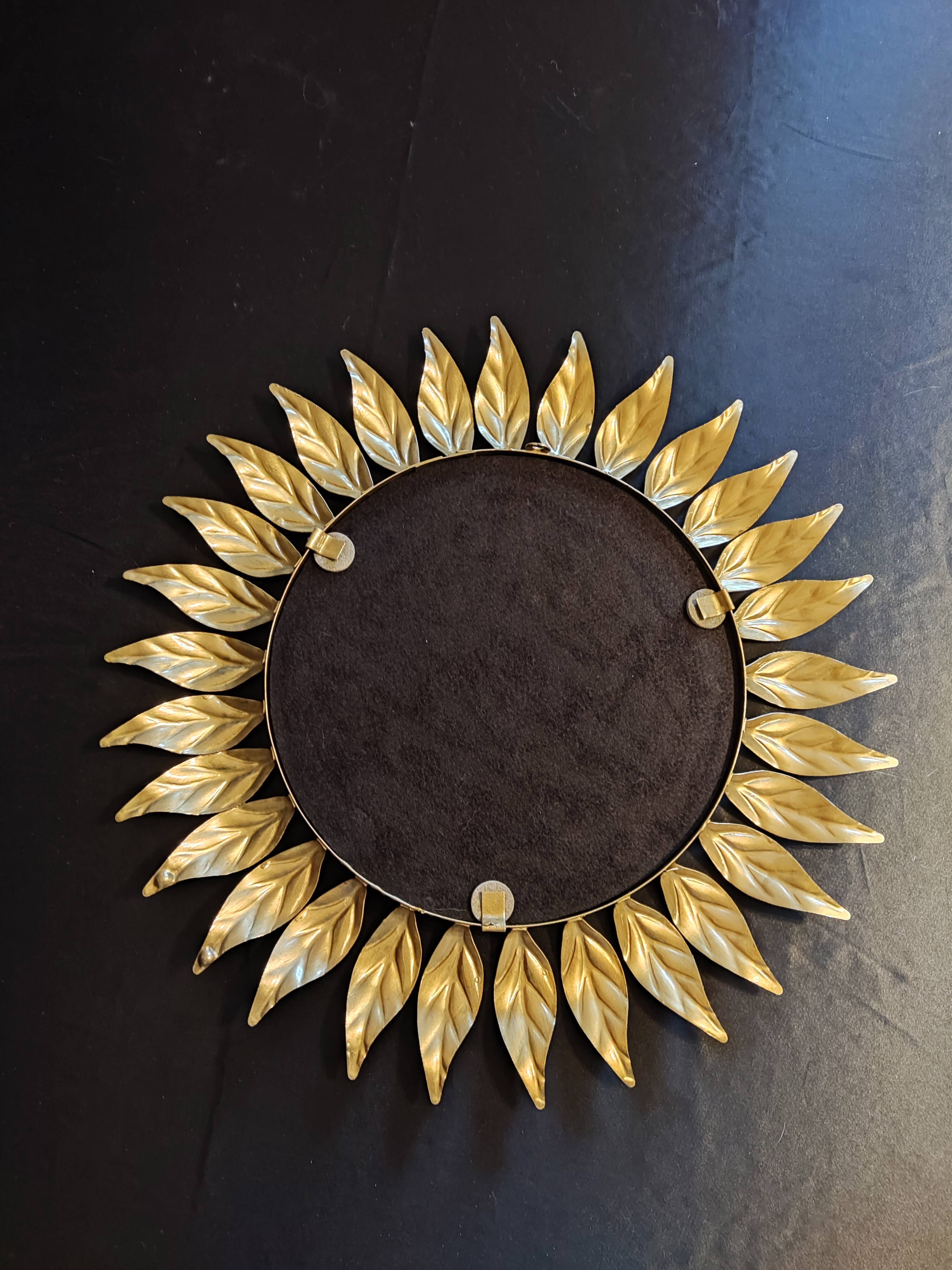 Miroir soleil en métal doré