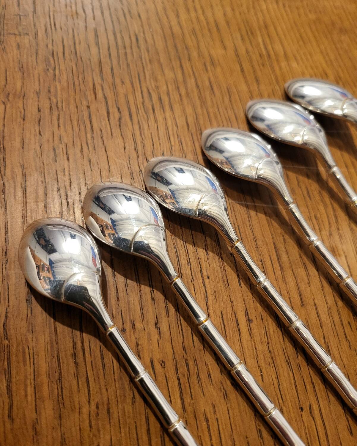 6 long silver-plated metal spoons