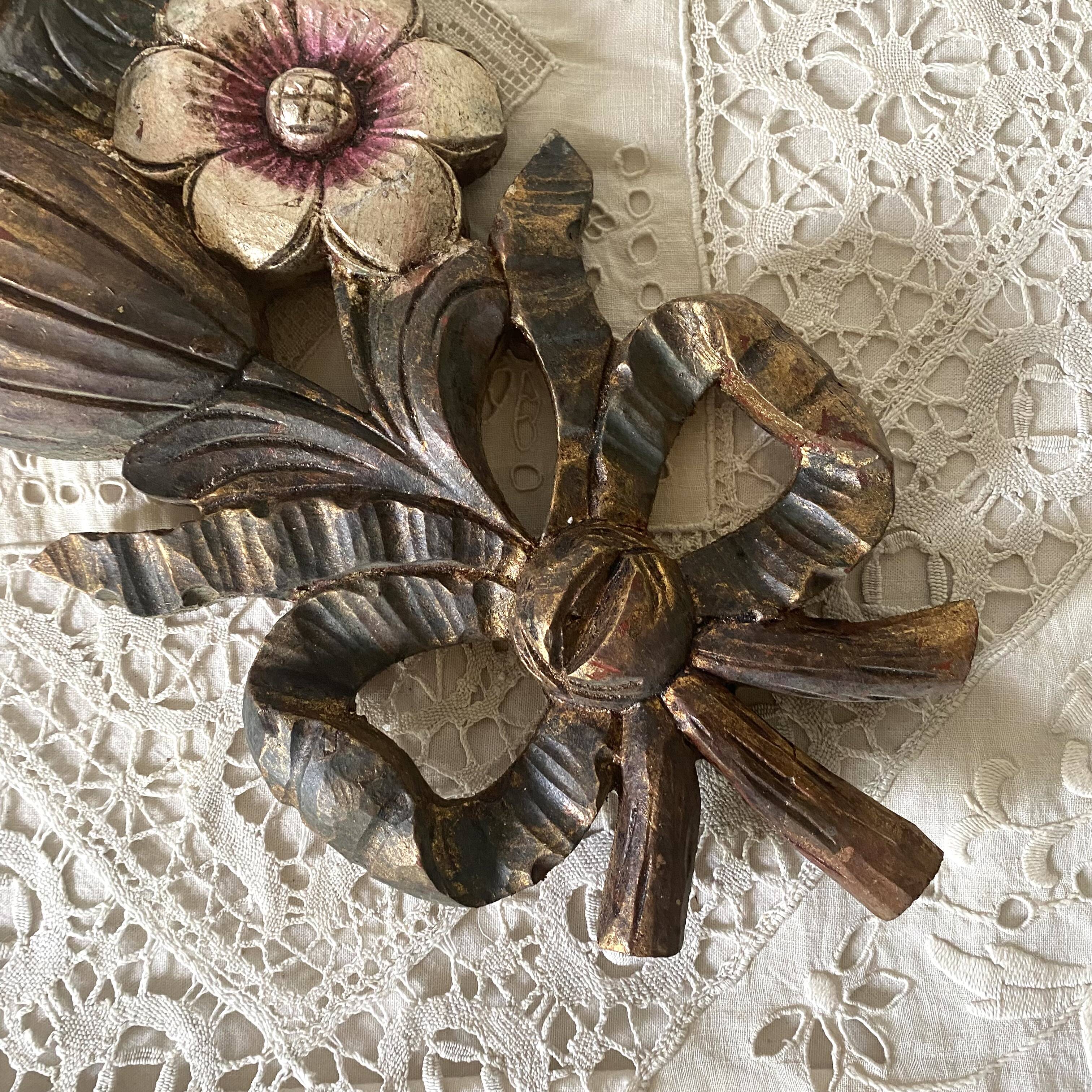 Decorative carved wooden ornament bouquet flowers and ribbon