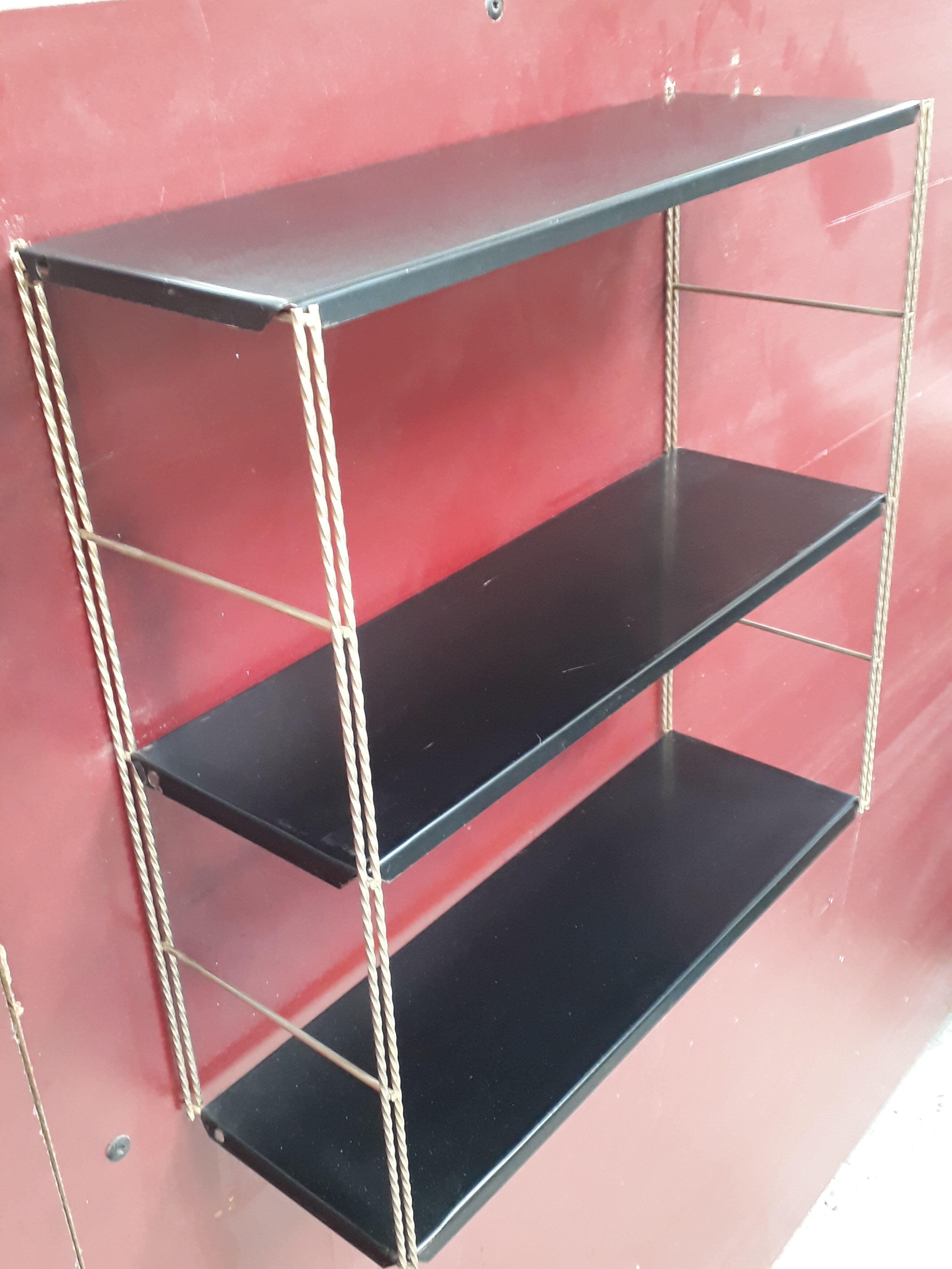 String shelf with twisted golden frame
