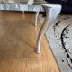 Contemporary coffee table with a marble top and steel base.