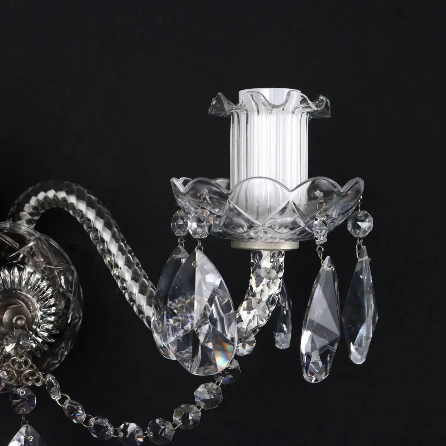 Antique wall light with 2 lights from the 1900s, featuring crystal bobeches and pendants.